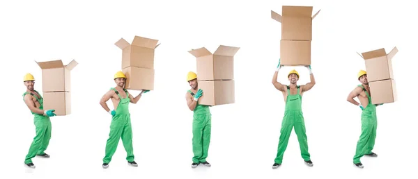 Bărbat în salopete verzi cu cutii — Fotografie, imagine de stoc