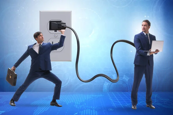 Businessman being powered by electricity and plug — Stock Photo, Image