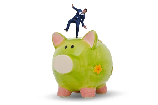 Businessman in debt concept with piggybank — Stock Photo, Image