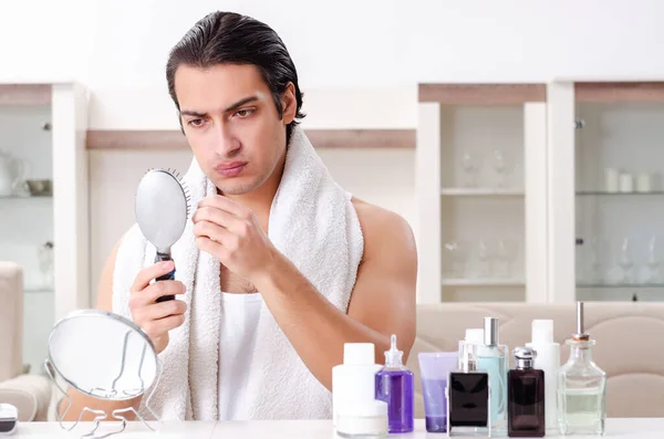 Young handsome man in the bathroom — Stock Photo, Image