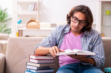 Young male student preparing for exams during Christmas