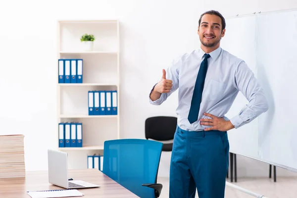 Young male employee in business presentation concept — Stockfoto