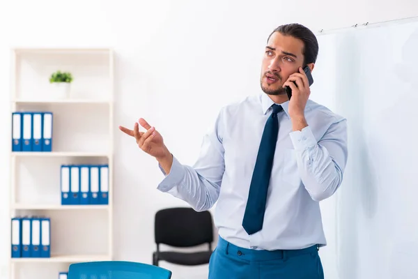 Young male employee in business presentation concept — Stock Photo, Image