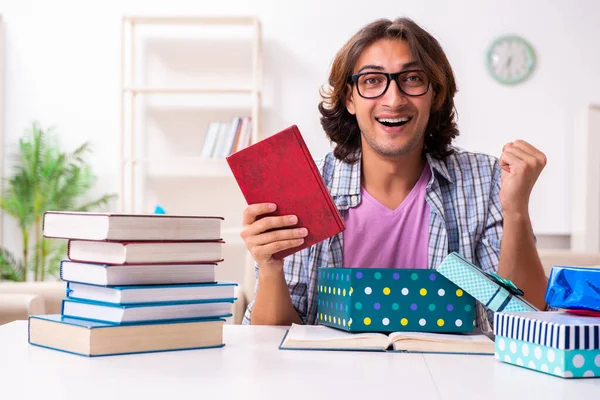 Young male student preparing for exams during Christmas — Stock Fotó