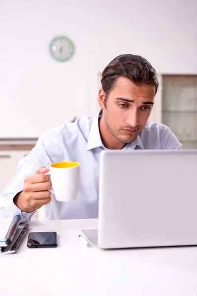 Young male businessman working at home — Stock Photo, Image