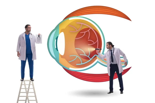 Doctor examining giant eye in medical concept — Stock Photo, Image