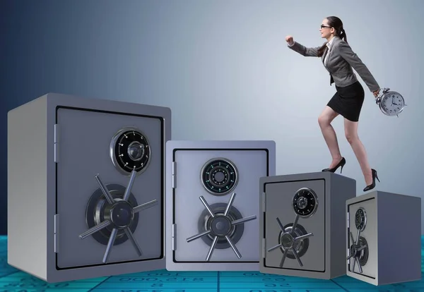 Businesswoman walking on top of safe — Stock Photo, Image