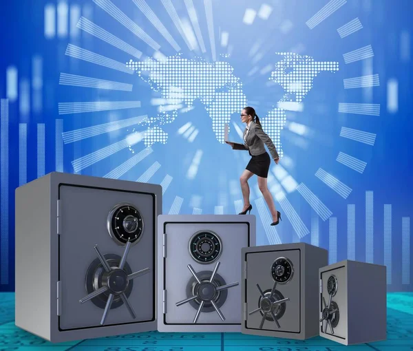 Businesswoman walking on top of safe — Stock Photo, Image