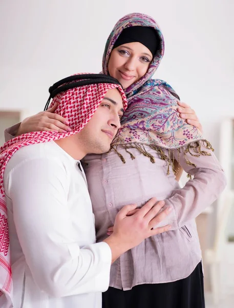 Young arab muslim family with pregnant wife expecting baby — Stock Photo, Image