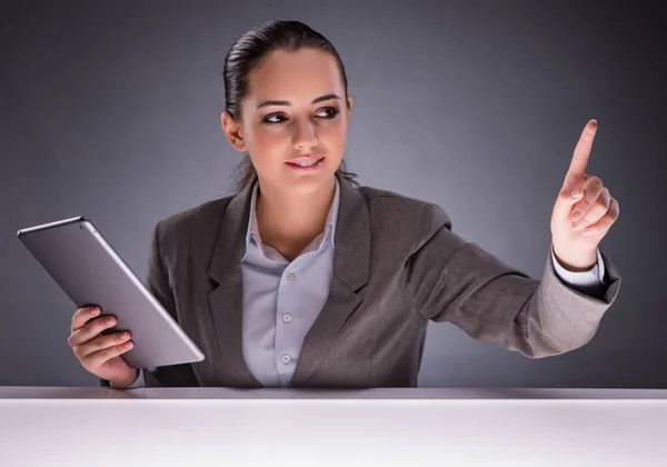 Woman with tablet computer in business concept