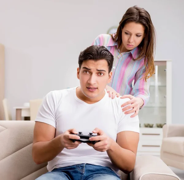 Young family suffering from computer games addiction — Stock Photo, Image