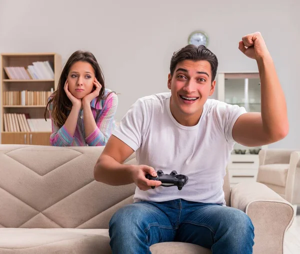 Young family suffering from computer games addiction — Stock Photo, Image