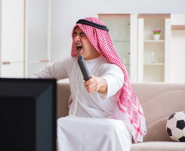 Arab businessman watching tv at home — Stock Photo, Image