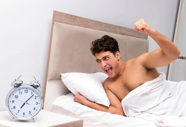 Young man having trouble waking up in the morning — Stock Photo, Image