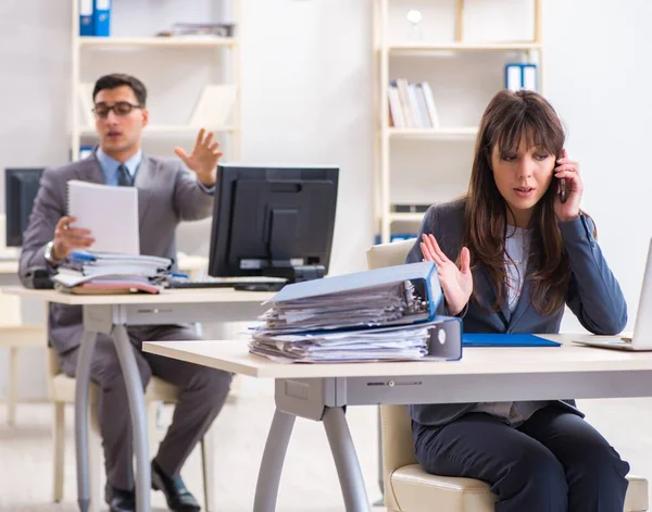 Man and woman working in the office