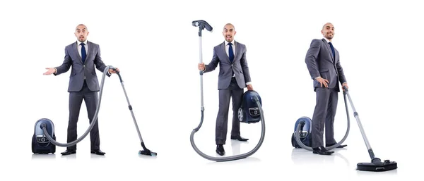 Businessman doing vacuum cleaning on white — Stock Photo, Image