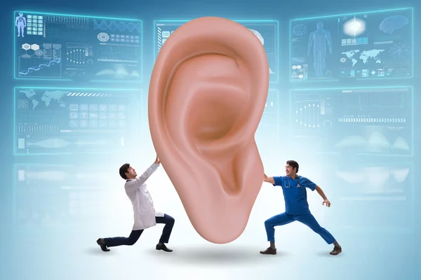 Médico examinando oído gigante en concepto médico —  Fotos de Stock