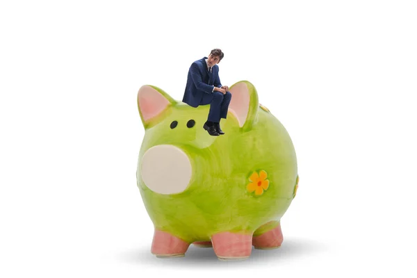 Piggybank ile borç konsepti içinde bir işadamı — Stok fotoğraf