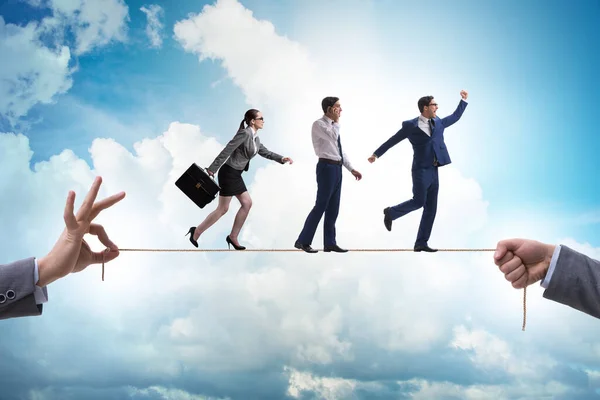 Business people walking on tight rope — 스톡 사진