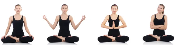 Young woman sitting cross-legged and doing yoga — Stock Photo, Image