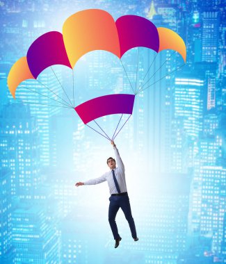 Genç işadamı iş konseptinde paraşütle atlıyor