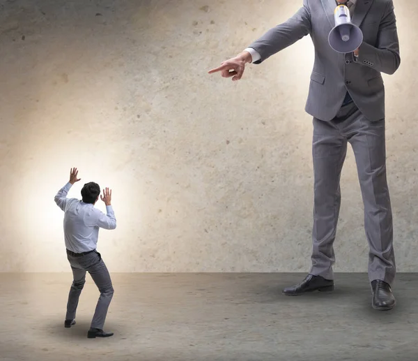 Bad angry boss shouting at employee with loudspeaker — Stock Photo, Image