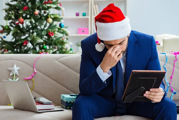 Businessman working at home during christmas — Stock Photo, Image