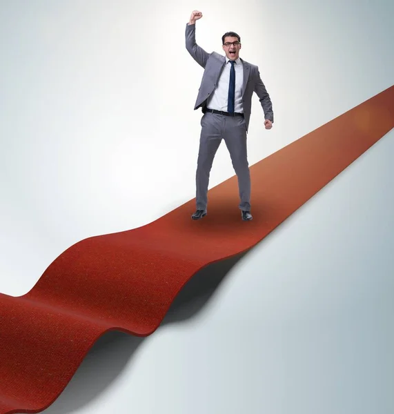 Businessman on the red carpet in success concept — Stock Photo, Image