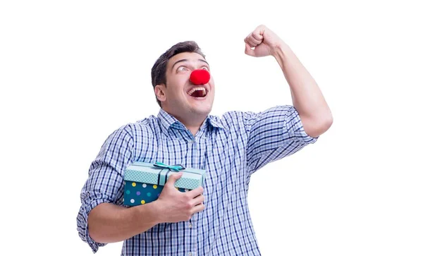 Man with a red nose funny holding a shopping bag gift present is — Stock Photo, Image