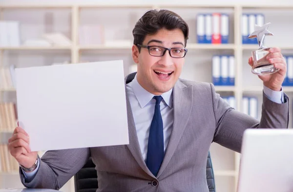 Businessman in office holding a blank message board — Stock Photo, Image