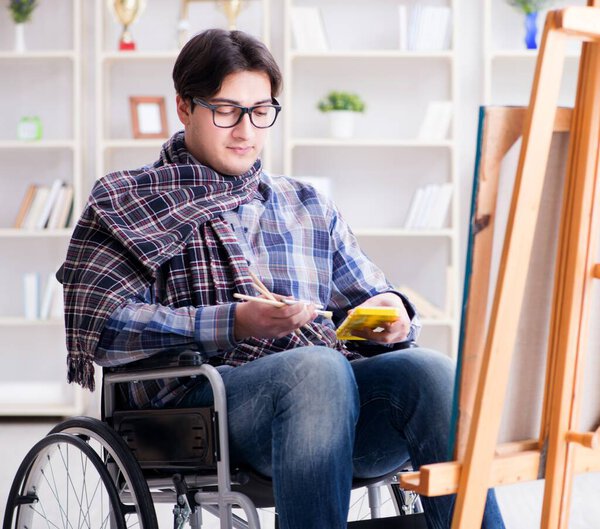 Картина художника-инвалида в студии