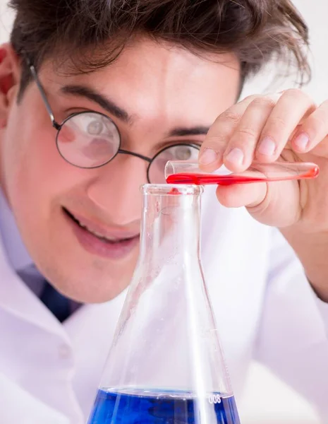 Mad crazy scientist doctor doing experiments in a laboratory — Stock Photo, Image