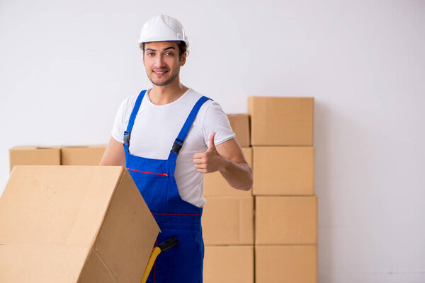 Young male professional mover doing home relocation