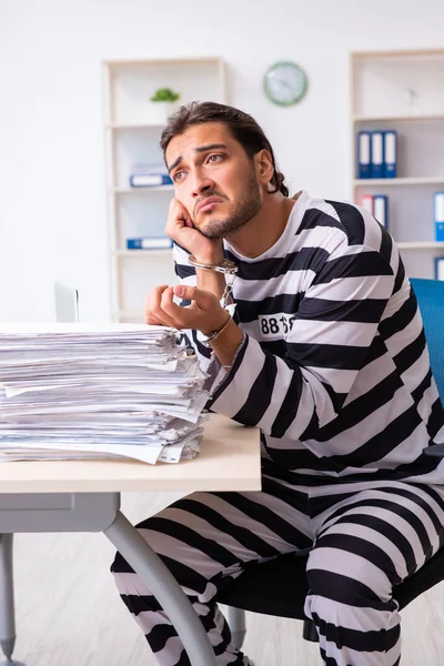 Young employee feeling like prisoner at work — Stock Photo, Image