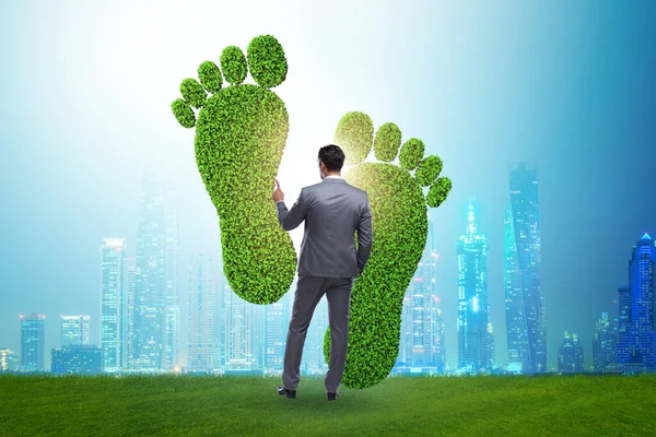 Carbon footprint concept with businessman — 스톡 사진