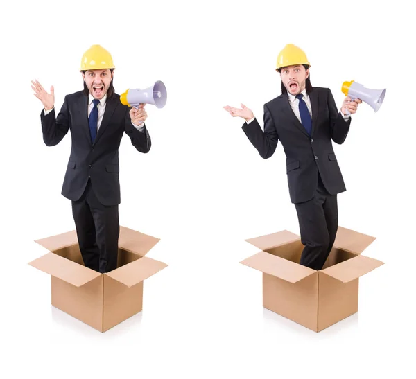 Hombre con casco y altavoz de pie en la caja — Foto de Stock