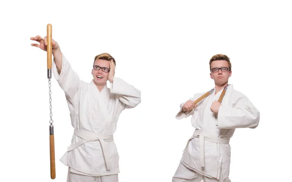 Legrační karate bojovník s nunčaky na bílém — Stock fotografie