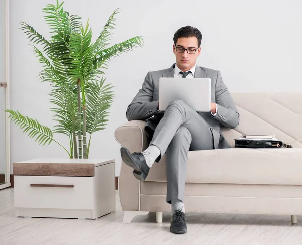 Businessman with laptop notebook sitting in sofa — Stock Photo, Image