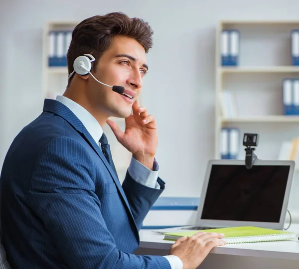 Young help desk operator working in office — Stock Photo, Image