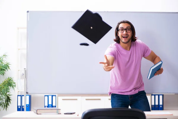Young male student graduate wearing mortarboard — Stock Photo, Image