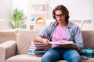 Young male student preparing for exams during Christmas