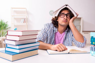 Young male student preparing for exams during Christmas