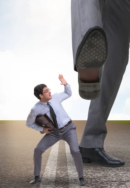 Bad angry boss kicking employee in business concept — Stock Photo, Image