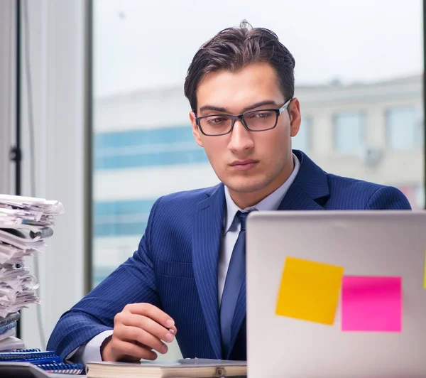Workaholic businessman overworked with too much work in office — Stock Photo, Image