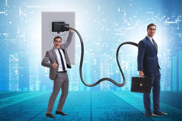 Businessman being powered by electricity and plug — Stock Photo, Image