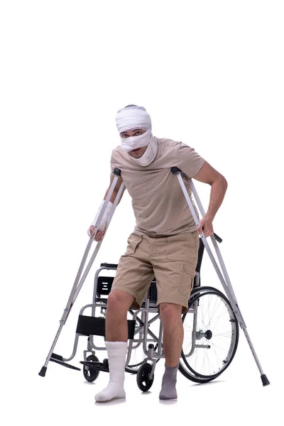 Injured man in wheel-chair isolated on white — Stock Photo, Image