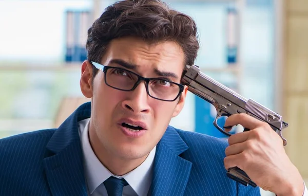 Stressed businessman thinking of suicide due to excessive worklo — Stock Photo, Image