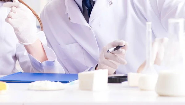 Two lab doctor testing food products