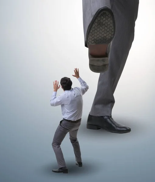 The bad angry boss kicking employee in business concept — Stock Photo, Image