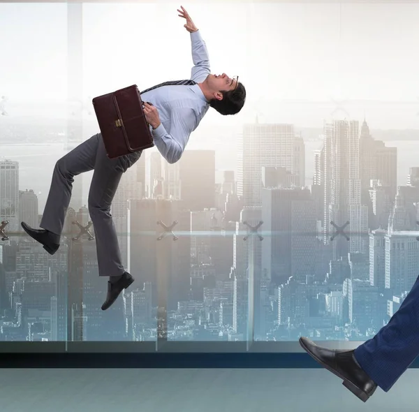 Bad angry boss kicking employee in business concept — Stock Photo, Image